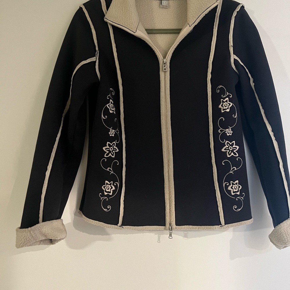 Black and cream jacket braided detail on outside. Inside is fleece lining.